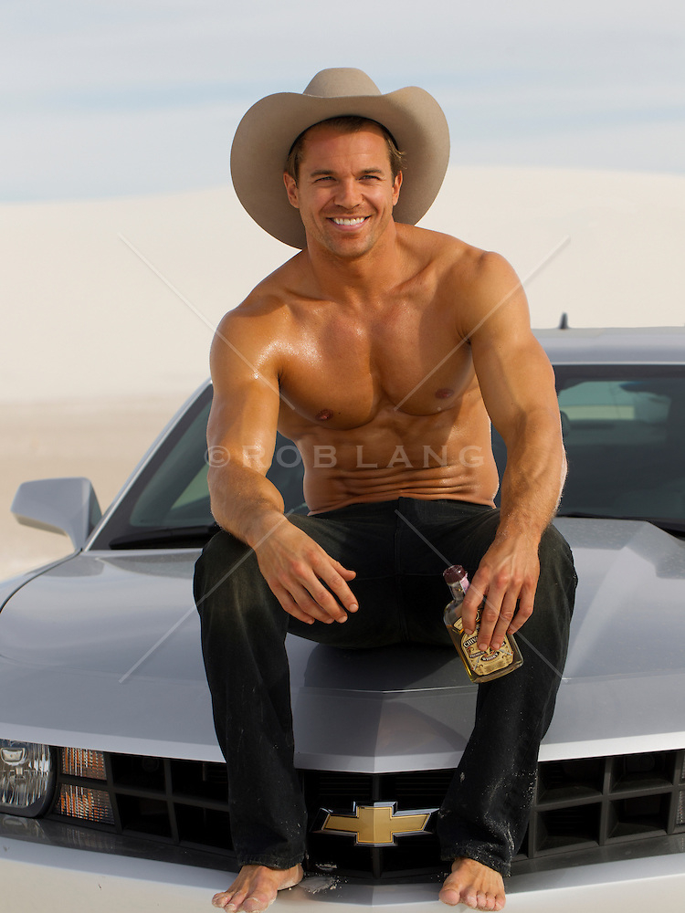 Handsome Man Without A Shirt Sitting On The Hood Of A Car ROB LANG